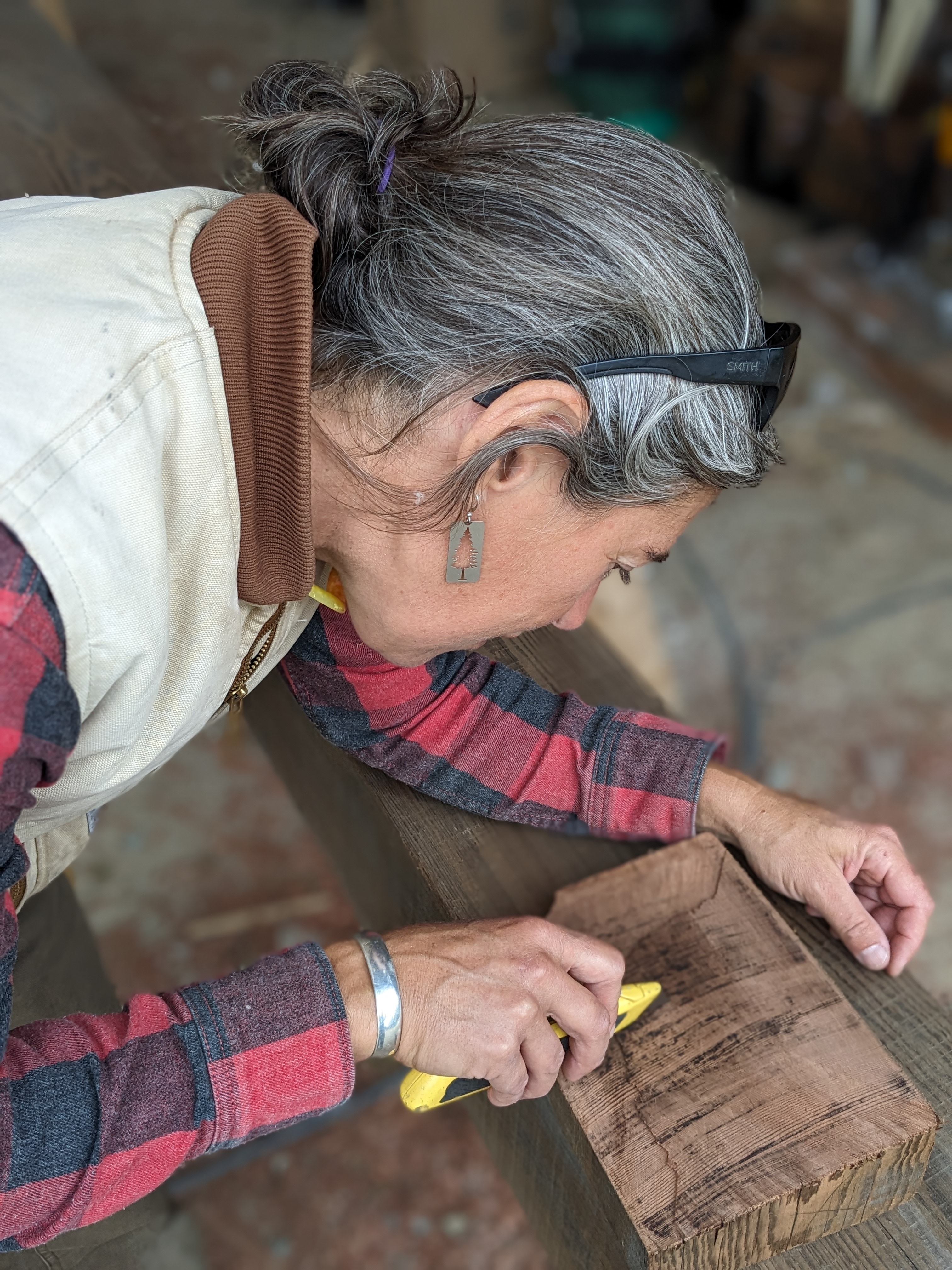 Student of a women's timber framing course and now Timber Club Member, working on a detail to finish a timber frame.